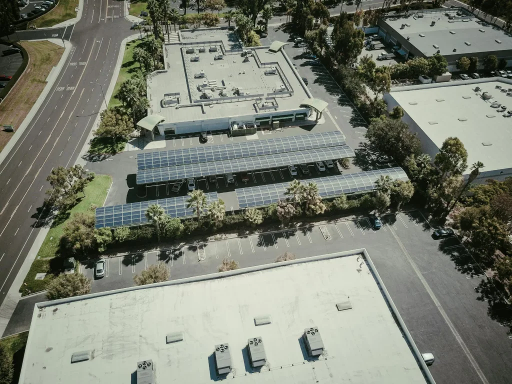 Drone shot of solar panels in a city showcasing sustainable energy use.